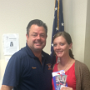 Grand Knight Kevin Strommer presents the game tickets and parking pass to Katie McDonnell of Blooming Grove.